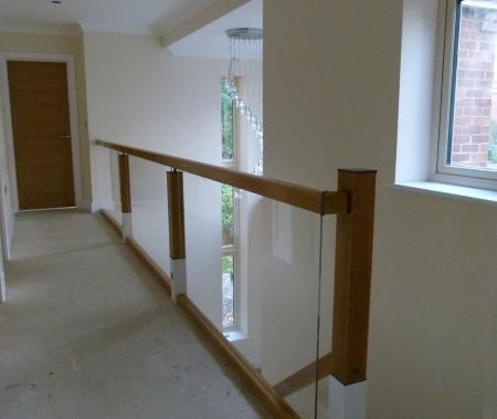 Landing with glass and oak ballustrade