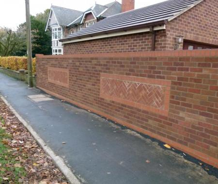 Front wall with ornate brickwork relief
